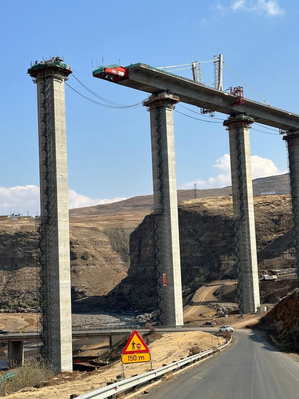 Senqu Bridge piers rising from the valley floor in Lesotho