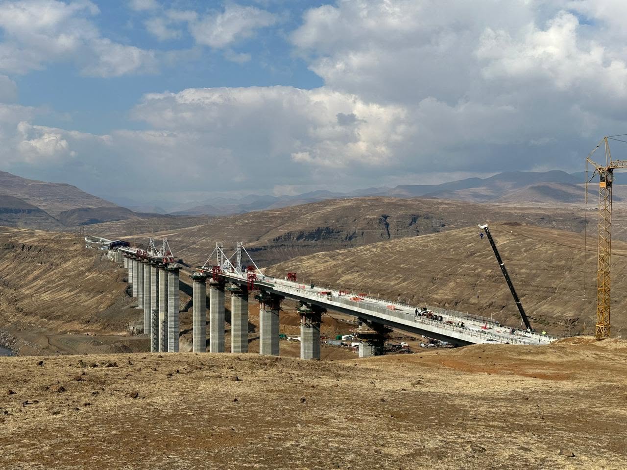 Senqu Bridge deck under construction across a valley in the Lesotho highlands